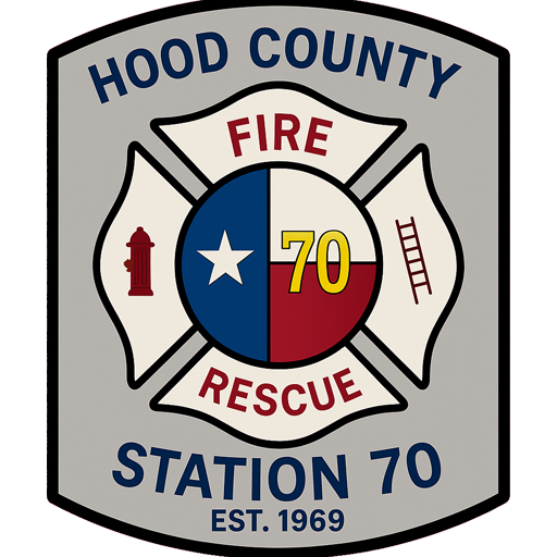 A patch with "Hood County Fire Rescue Station 70 Est. 1969." It features a firefighter cross with a hydrant, ladder, and the number 70 on a Texas flag design in the center.